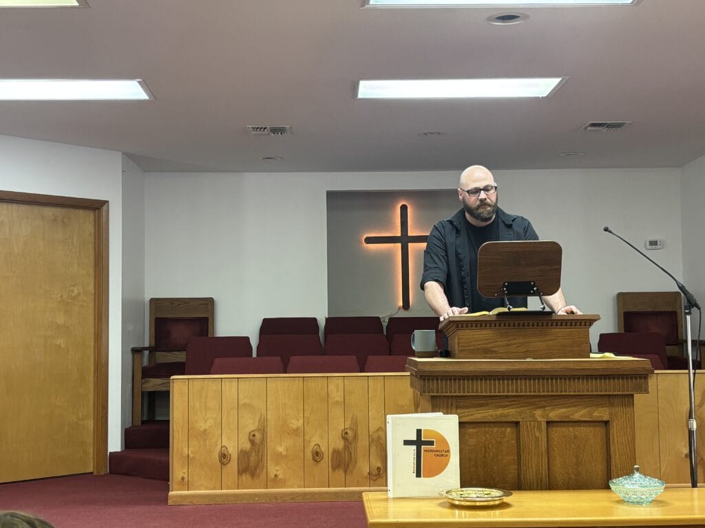 Pastor speaking at the front of the Morningstar sanctuary